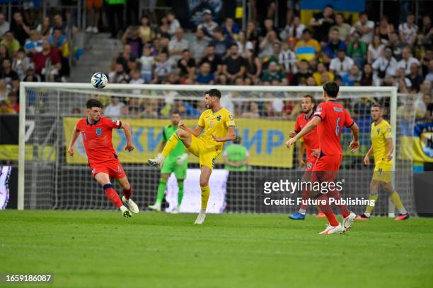Forward Roman Yaremchuk of Ukraine is seen in action with midfielder Declan Rice of England during the UEFA EURO 2024 Qualifying Round Matchday 5...