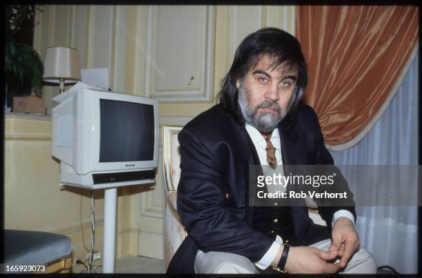 Greek composer and keyboard player Vangelis poses at his apartment in Paris, 9th June 1991.