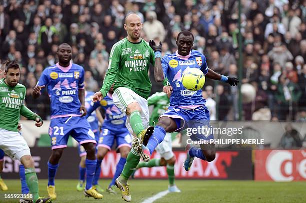 Evian's Ghanaian midfielder Mohammed Rabiu vies with Saint-Etienne's French midfielder Renaud Cohade during the French L1 football match...
