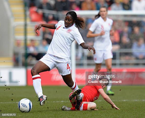 Anita Asante of England is challenged by Diana Matheson of Canada during the Women's International Match between England Women and Canada Women at...