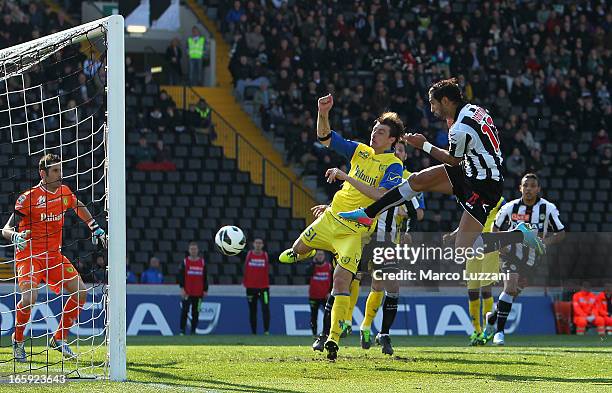 Medhi Benatia of Udinese Calcio scores their third goal during the Serie A match between Udinese Calcio and AC Chievo Verona at Stadio Friuli on...