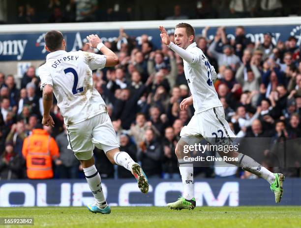 Gylfi Sigurdsson of Tottenham Hotspur celebrates scoring their second goal with Clint Dempsey of Tottenham Hotspur during the Barclays Premier League...
