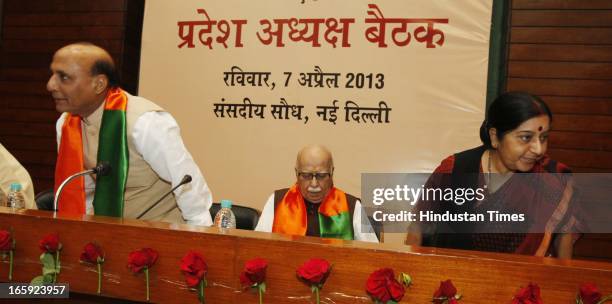 President Rajnath Singh with party leaders LK Advani and Sushama swaraj during first meeting of newly-appointed office bearers of the party on April...