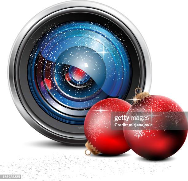 camera lens and christmas baubles - dslr camera stock illustrations