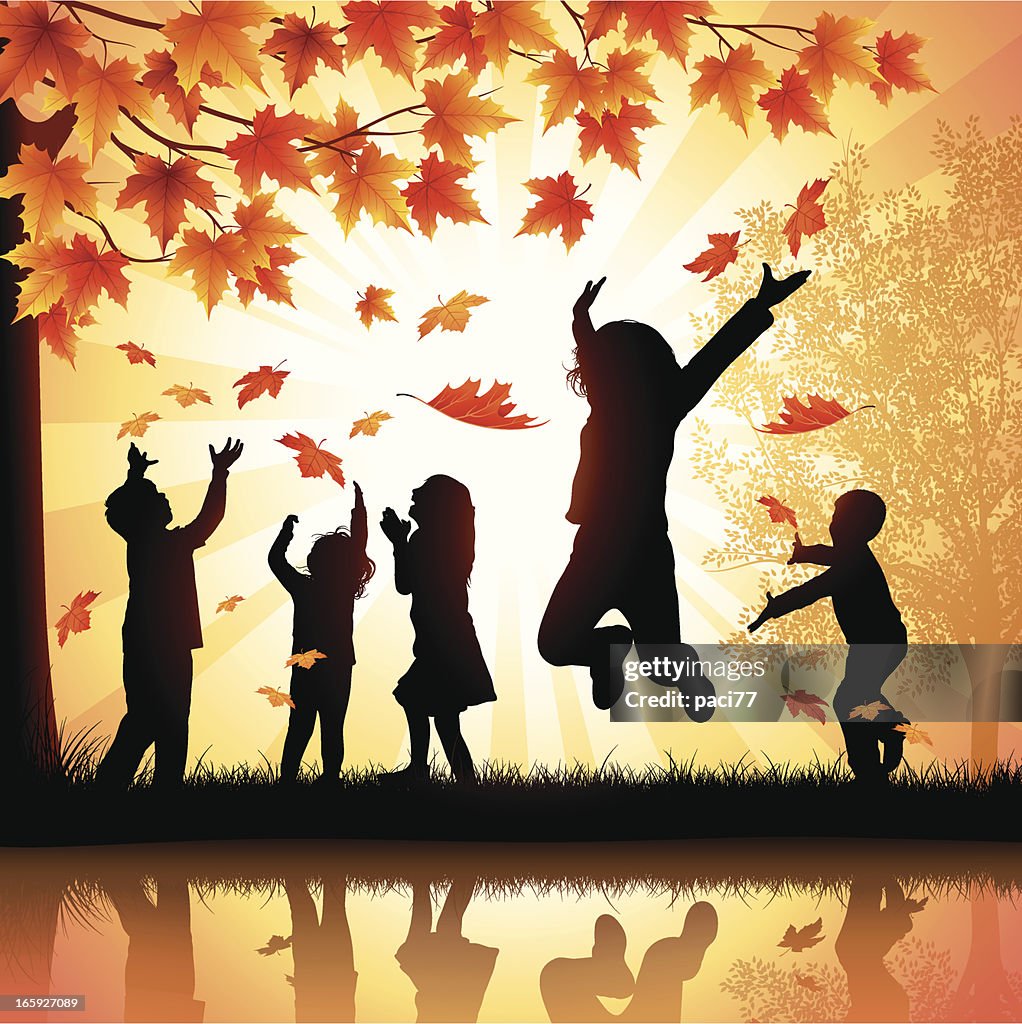 Happy Children Playing with Leaves