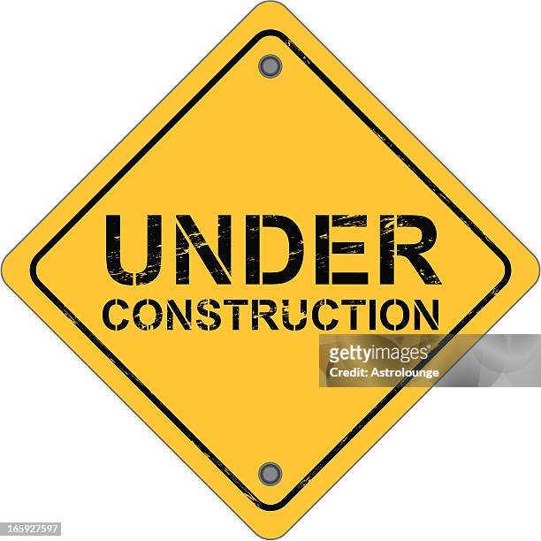 diamond-shaped work sign that reads under construction  - demolition site stock illustrations