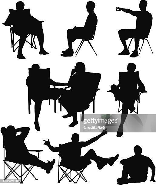 mann auf einem stuhl sitzend - klappstuhl stock-grafiken, -clipart, -cartoons und -symbole
