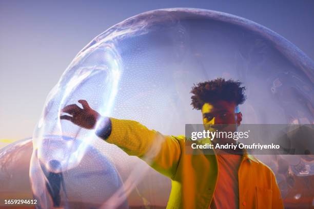 inside bubble spheres - new dawn stock pictures, royalty-free photos & images