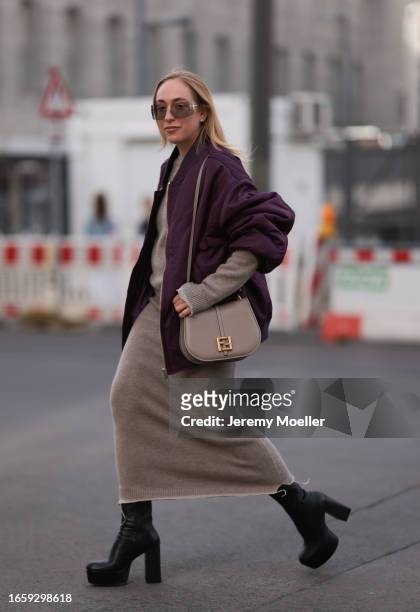 Sonia Lyson seen wearing Miu Miu brown transparent sunglasses, Fendi beige knit pullover, matching beige knit long skirt, The Frankie Shop purple /...