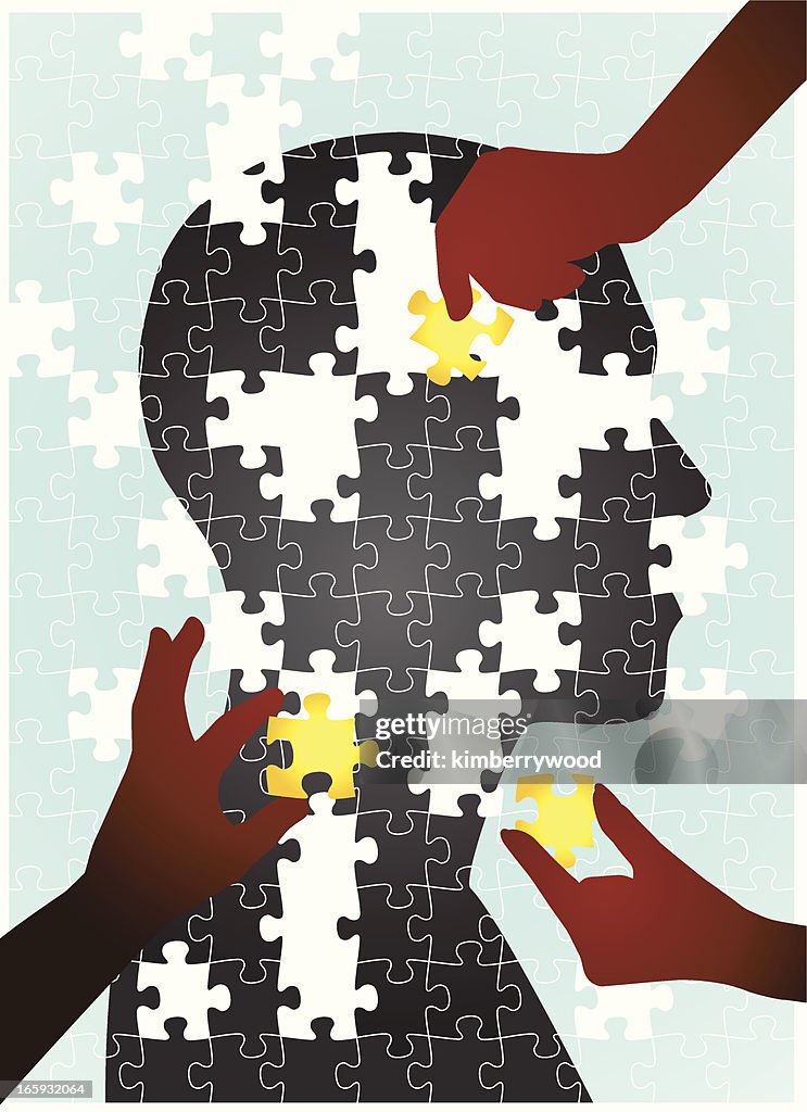 Puzzle of human silhouette with pieces put together by hands
