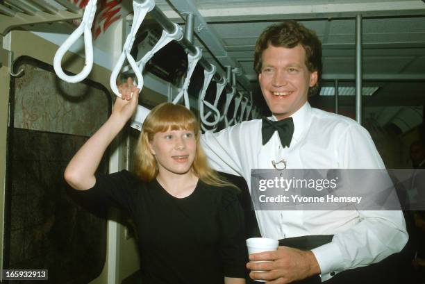 Amy Carter and television host David Letterman are photographed on the set of the David Letterman Show resembling a subway train car June 3, 1982 in...