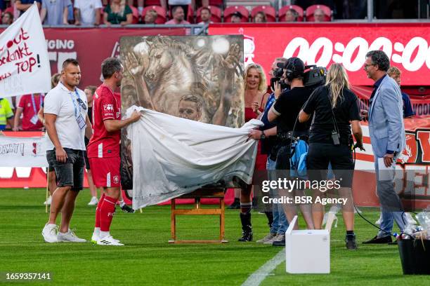 Wout Brama of FC Twente 2010 & 2011 uncovering a painting during the Farewell match of Wout Brama between FC Twente 2010 & 2011 and Wouts All Stars...