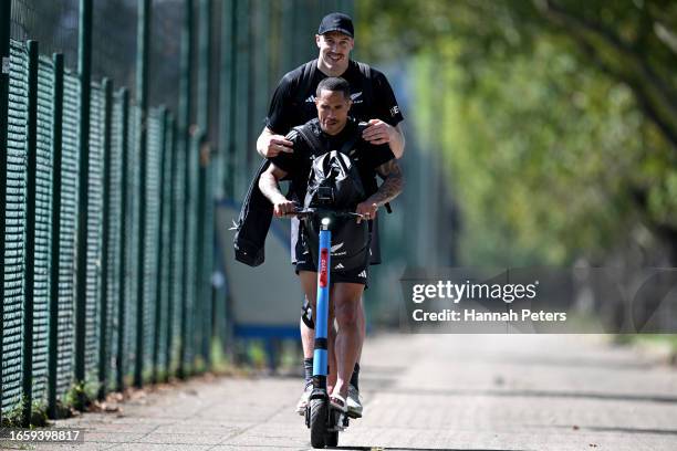 Brodie Retallick and Aaron Smith of the All Blacks ride on a scooter following a New Zealand All Blacks training session at LOU rugby club on...