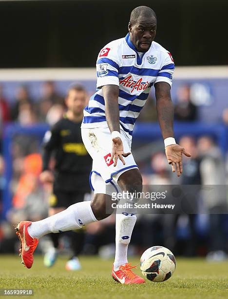 Christopher Samba of Queens Park Rangers with the ball during the Barclays Premier League match between Queens Park Rangers and Wigan Athletic at...