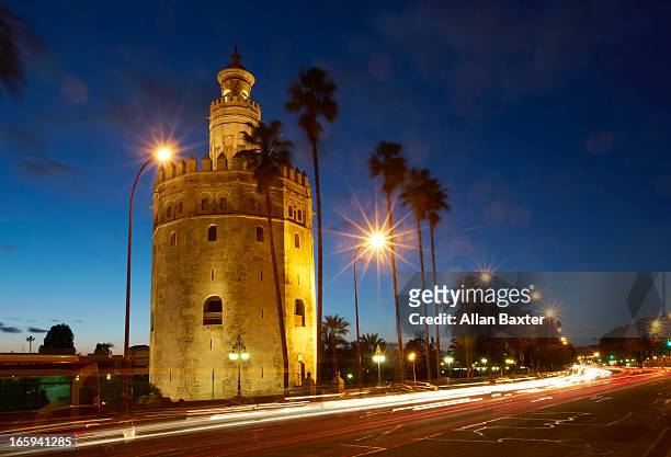 torre del oro at night - torre del oro stock pictures, royalty-free photos & images