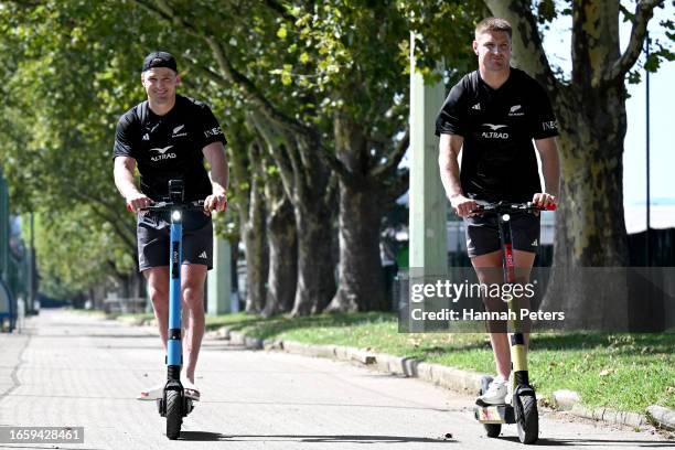 Beauden Barrett and Jordie Barrett of the All Blacks ride on scooters following a New Zealand All Blacks training session at LOU rugby club on...