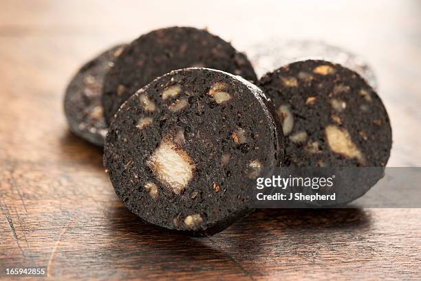 fired black pudding - black pudding stock pictures, royalty-free photos & images