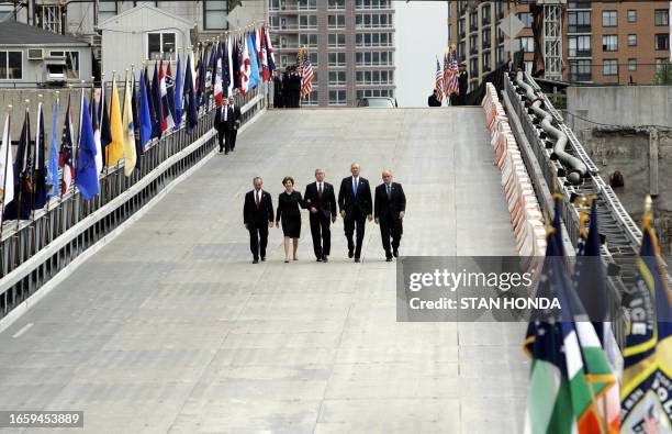 President George W. Bush and First Lady Laura Bush are accompanied by New York City Mayor Michael Bloomberg , New York State Governor George Pataki...