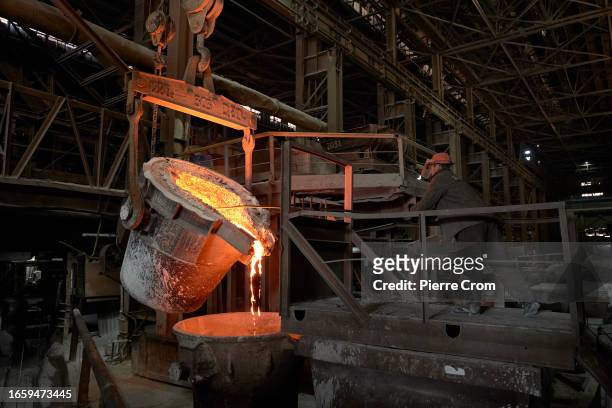 Workers produce ferro alloys in the Zaporozhye Ferroalloy Plant on September 11, 2023 in Zaporizhzhia, Ukraine. The plant functions with a limited...