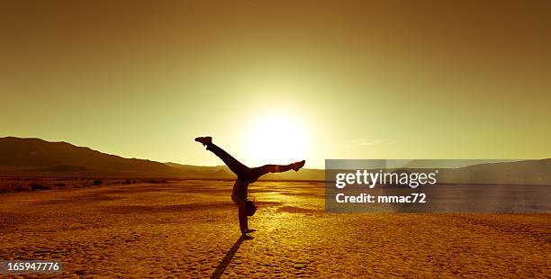 backlight acrobatics - backflipping stock pictures, royalty-free photos & images