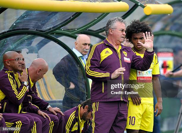 Head coach Guus Hiddink speaks to Willian of FC Anzhi Makhachkala during the Russian Premier League match between FC Anzhi Makhachkala and FC Alania...