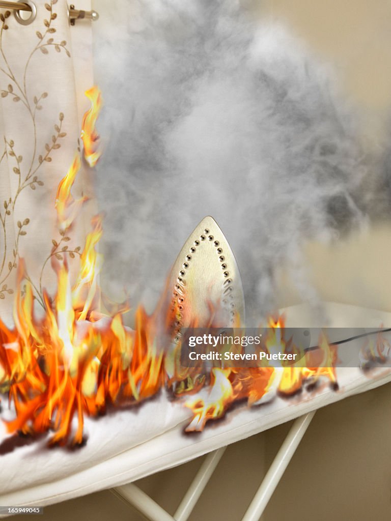 Ironing board and room on fire