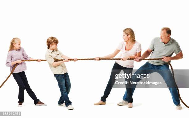 family playing a game of tug o war - isolated - pulling stock pictures, royalty-free photos & images