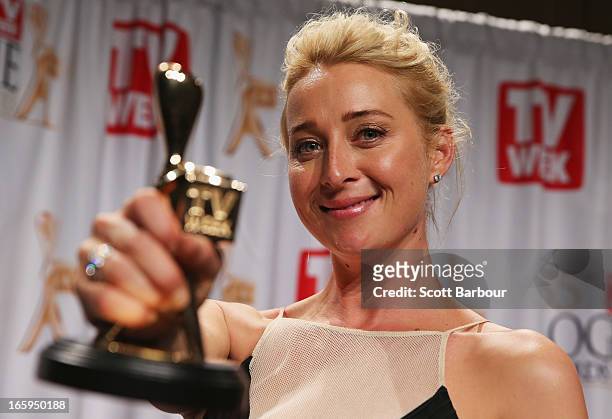 Asher Keddie celebrates in the awards room after winning the Gold Logie for Most Popular Personality on Australian Television at the 2013 Logie...