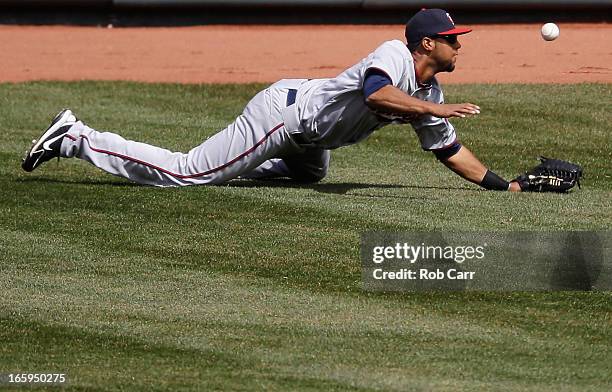 Centerfielder Aaron Hicks of the Minnesota Twins miss judges a double by Adam Jones of the Baltimore Orioles during the third inning at Oriole Park...