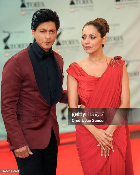 Shahrukh Khan and his Wife Gauri Khan walk the red carpet at The Times Of India Film Awardson April 6, 2013 in Vancouver, Canada.