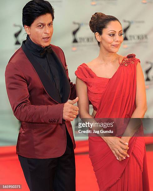 Shahrukh Khan and his Wife Gauri Khan walk the red carpet at The Times Of India Film Awardson April 6, 2013 in Vancouver, Canada.