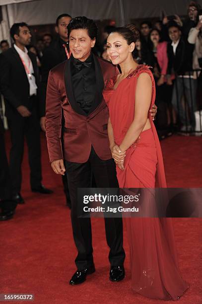 Shahrukh Khan and his Wife Gauri Khan walk the red carpet at The Times Of India Film Awardson April 6, 2013 in Vancouver, Canada.