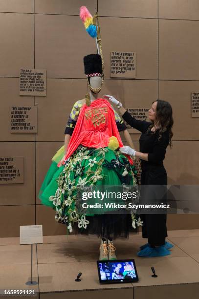 Staff member adjusts a creation design by Matty Bovan for his Spring/Summer 2019 collection during a photocall for the upcoming exhibition REBEL: 30...