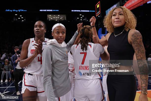 The Washington Mystics huddle up and celebrate after the game against the New York Liberty on September 10, 2023 in Brooklyn, New York. NOTE TO USER:...