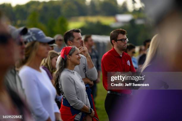 Visitors listen to the roll call of names of the victims during a ceremony commemorating the 22nd anniversary of the crash of Flight 93 during the...