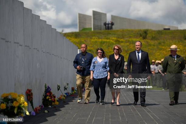 United States Second Gentleman Douglas Emhoff walks along the Wall of Names with Deborah Borz, mother of crash victim Deora Frances Bodley, during a...