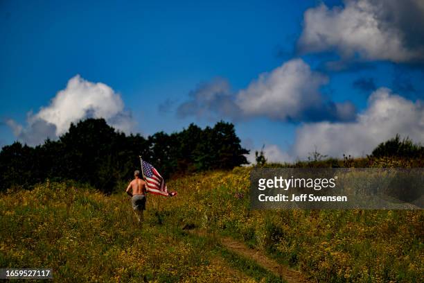 Solitary runner runs through the fields following a wreath-laying ceremony commemorating the 22nd anniversary of the crash of Flight 93 during the...
