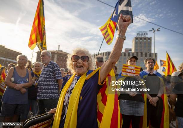 Maria Reus wears a Catalan pro-independence flag during demonstrations on September 11, 2023 in Barcelona, Spain. The Catalan National Day, also...