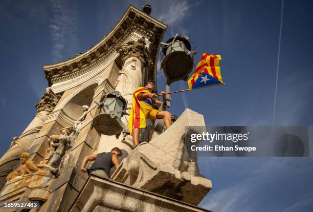 Person waves a Catalan pro-independence flag during demonstrations on September 11, 2023 in Barcelona, Spain. The Catalan National Day, also known as...