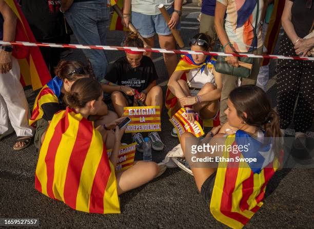 People wearing Catalan pro-independence flags gather during demonstrations on September 11, 2023 in Barcelona, Spain. The Catalan National Day, also...