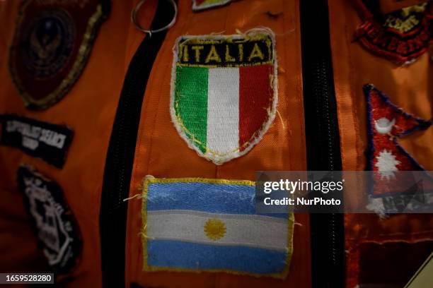 Shields of the flags of Italy and Argentina of the Azteca Topos International Rescue Brigade inside the Mexico City International Airport, before...