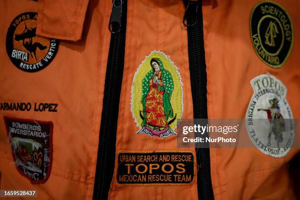 Shield of the Virgin of Guadalupe of the Azteca Topos International Rescue Brigade inside the Mexico City International Airport, before traveling to...