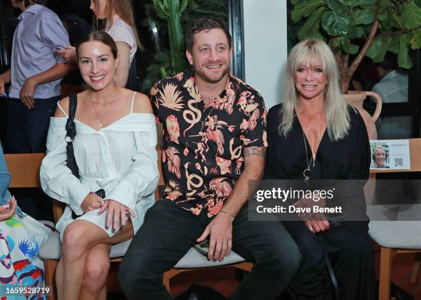 Faye Harris, Tyrone Wood and Jo Wood attend the VIN + OMI "OMNIA" Show at One Hundred Shoreditch on September 11, 2023 in London, England.