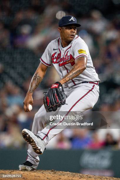 Raisel Iglesias of the Atlanta Braves pitches in the ninth inning during the game between the Atlanta Braves and the Colorado Rockies at Coors Field...