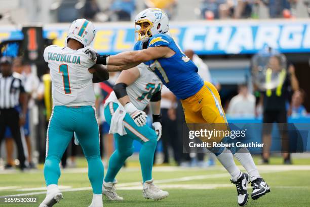 Inglewood, CA, Sunday, Sept. 10, 2023 - Los Angeles Chargers linebacker Joey Bosa is too late to stop the pass of Miami Dolphins quarterback Tua...