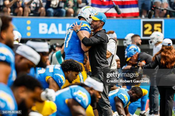 Inglewood, CA, Sunday, Sept. 10, 2023 - Head Coach Brandon Staley embraces Los Angeles Chargers linebacker Joey Bosa before a game against the Miami...