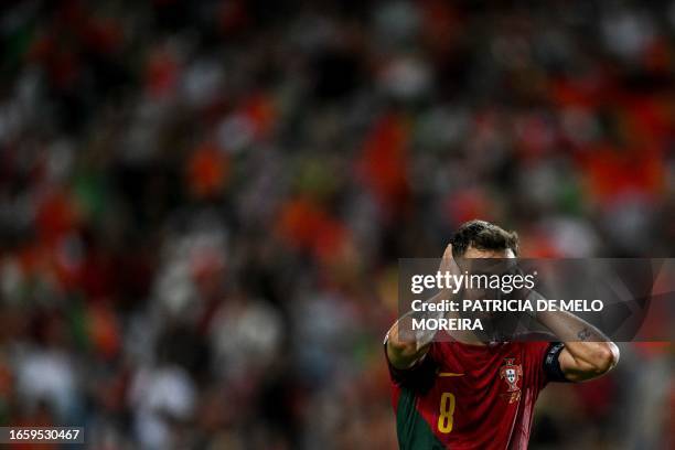 Portugal's midfielder Bruno Fernandes celebrates after scoring a goal during the EURO 2024 first round group J qualifying football match between...