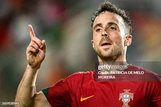 Portugal's forward Diogo Jota celebrates after scoring a goal during the EURO 2024 first round group J qualifying football match between Portugal and...