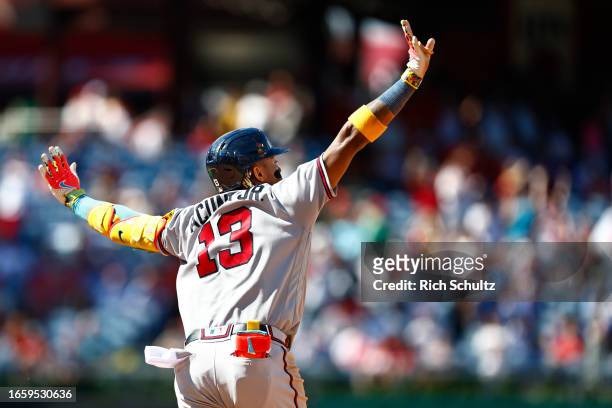 Ronald Acuna Jr. #13 of the Atlanta Braves flaps his arms after hitting a home run against the Philadelphia Phillies in the sixth inning during game...