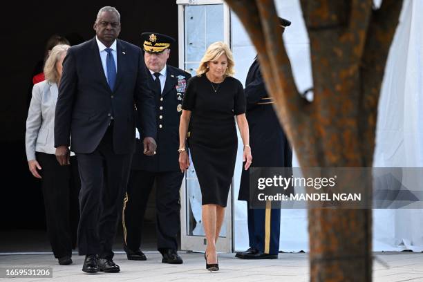 First Lady Jill Biden , US Defense Secretary Lloyd Austin and Chairman of the Joint Chiefs of Staff, Army General Mark Milley, arrive to participate...